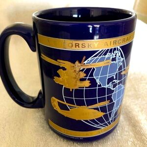 New Specialty Mug, dark blue w/metallic gold Aprox 4 1/2” tall, 5”w/incld handle